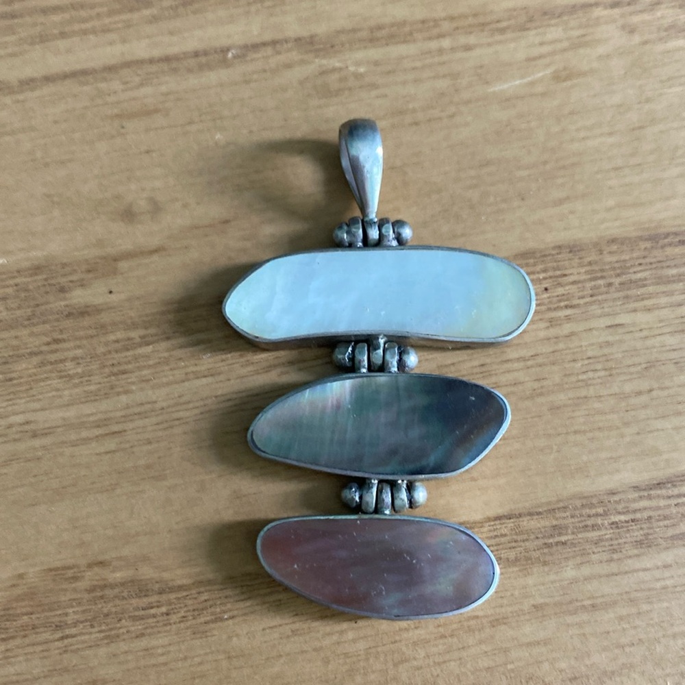 Sterling silver pendant. Three varying shades of stone.